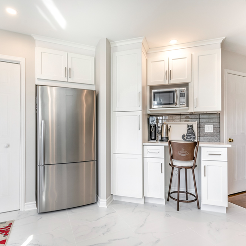 Custom cabinets with white crown molding in a Madison Kitchen